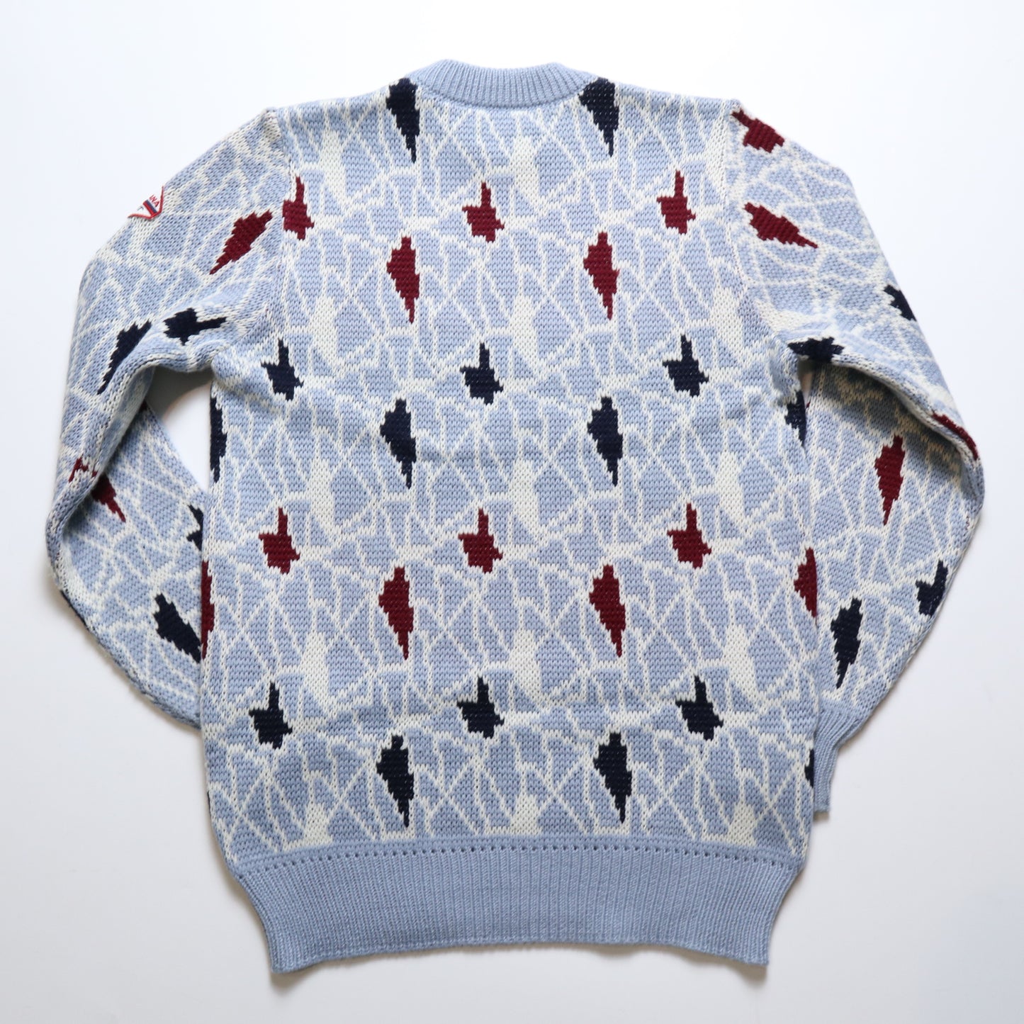 イタリア製のブルーの幾何学模様のトーテム セーター